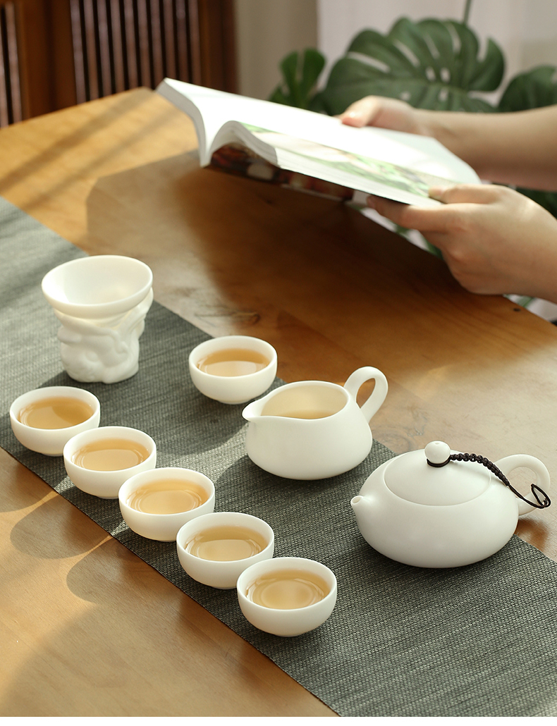 Dehua suet jade biscuit firing manual white porcelain kung fu tea set suit household ceramic teapot of a complete set of tea cups