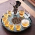 Bàn trà bằng đá tự nhiên gốm loại lưu trữ nước nhỏ Đá Wujin hiện đại nhỏ gọn văn phòng tại nhà khay trà kung fu bộ trà nĩa gỗ Tấm