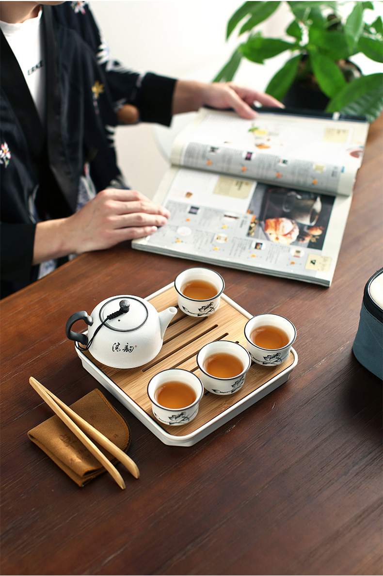 Zhuo imperial travel tea set to crack a cup of tea set a pot of four cups of tea set, ceramic work outdoors with the teapot