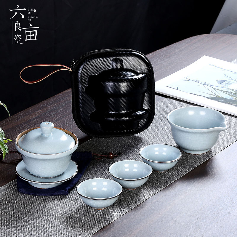 Crack cup against a pot of three cups of hot ceramics glass portable travel kung fu tea set contracted