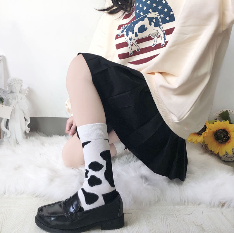 Socks female Japanese trendy socks girl creative black and white cow socks Korean version of the student cute personality retro medium tube socks