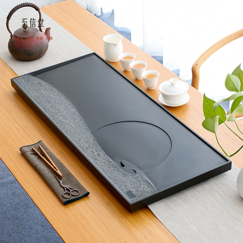 To the xintang whole piece of Ujinshi tea tray natural stone tea table size household black gold stone stone tea sea simple