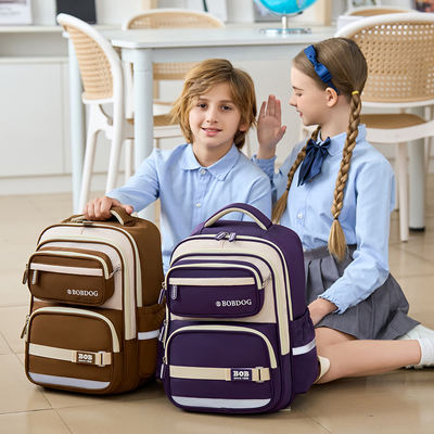 Hong Kong primary school students' schoolbags for grades one, two, three to six, 2025 new style, lightweight and weight-reducing backrest bags for boys and girls
