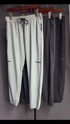 Мужчины, управляющие штанами футбольные баскетбольные брюки бега