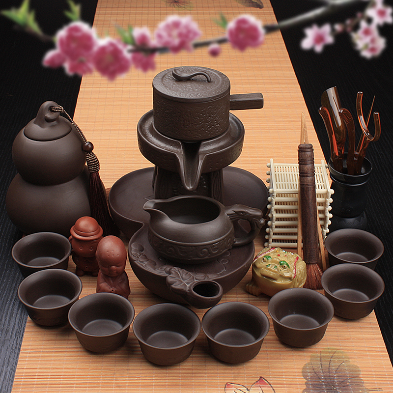 Lazy stone mill tea set ceramic violet arenaceous household kung fu suit all semi - automatic hot tea cups creative tea POTS