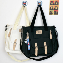 Anta? Simple casual solid color large-capacity shoulder bag mens ins Japanese style Hong Kong style messenger bag female students class diagonal