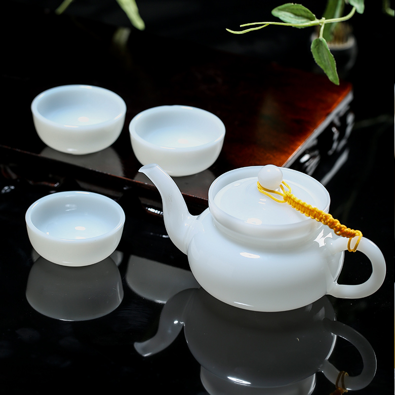 White porcelain kung fu tea set suit household contracted sitting room of jingdezhen ceramics pure color kung fu tea cup high - grade gift boxes