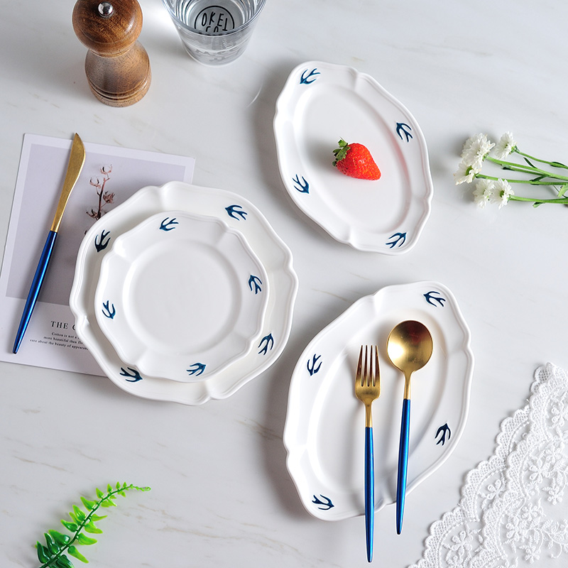 Japan 's tail single blue swallow disc white anaglyph hand - made ceramic plate dessert dish of bread plate oval tray is restoring ancient ways