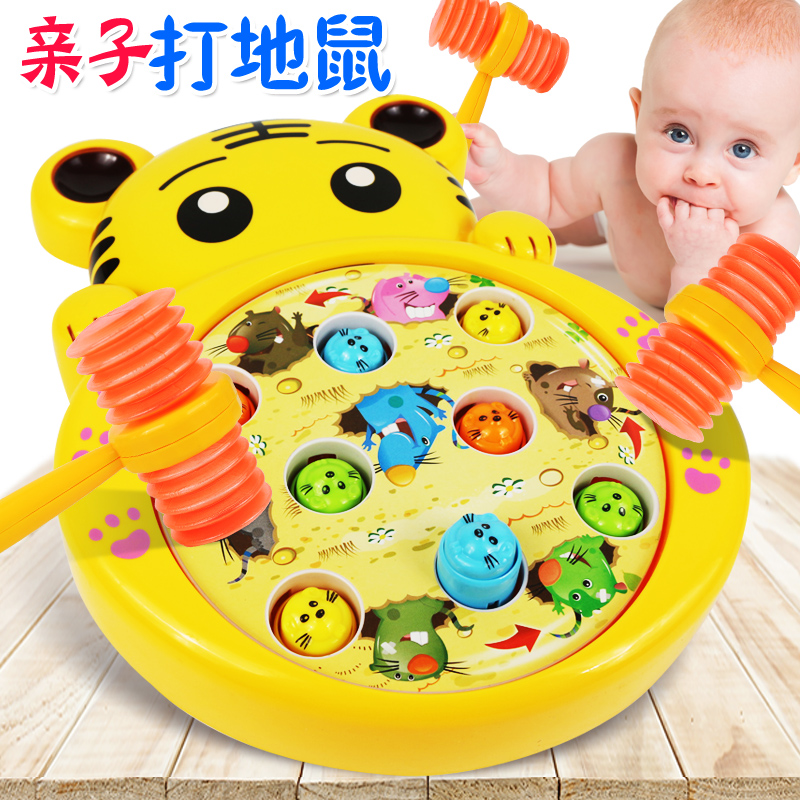 Children hit the ground rat 1-2-year-old toy knocks the baby boy and child joyfully smashed the mouse small game sound hammer