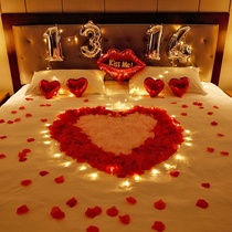 Male and female friends make romantic surprise confession proposal rose petal hotel bed room balloon arrangement Valentines Day