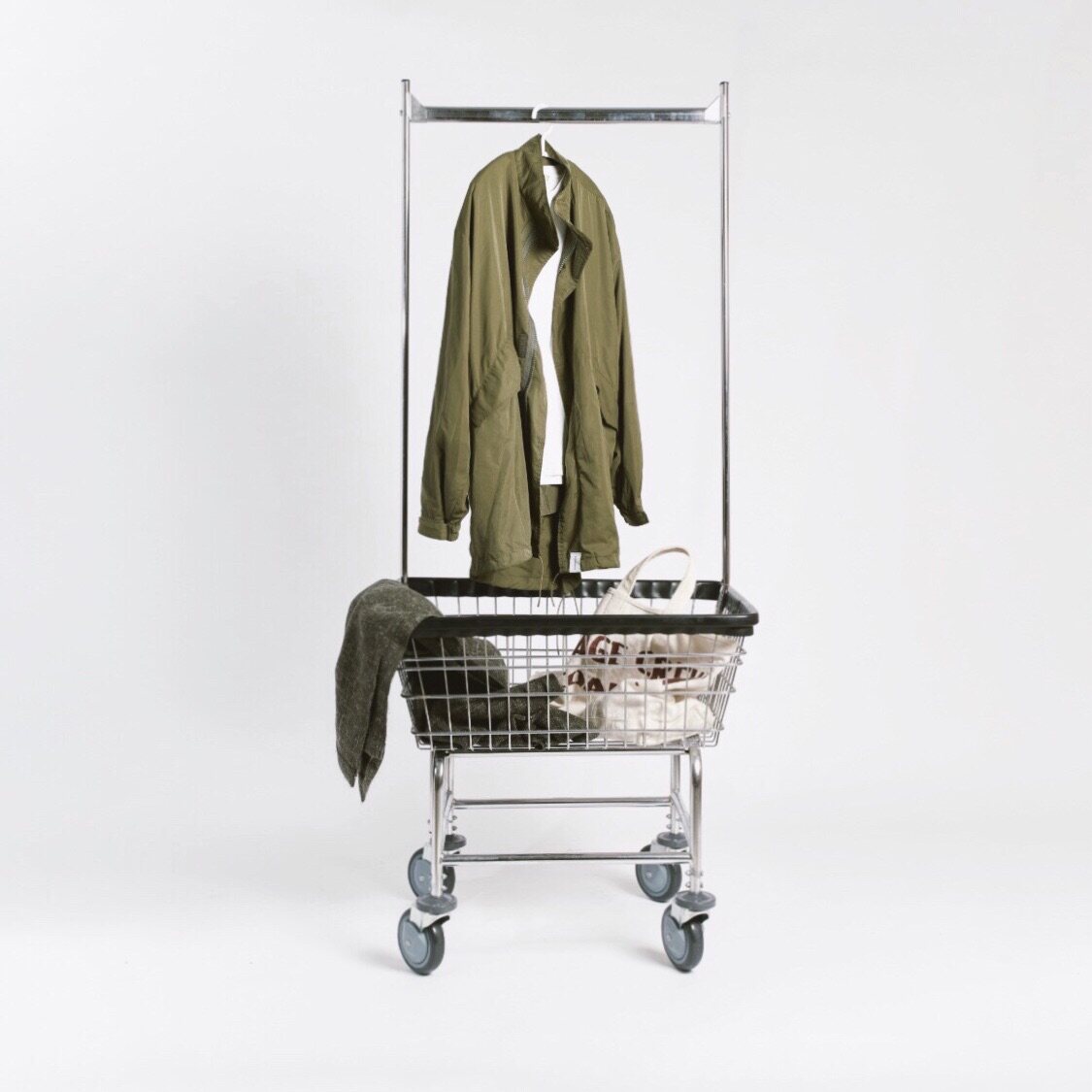 Two-unit 501 American mobile hanger trolley clothing item display containing basket cloak holder spot