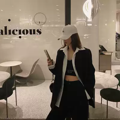 Xiaonian custom black and white fake two-piece design sense blazer female Korean version loose casual wild long-sleeved suit tide