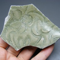 3235 A specimen of a folded rim bowl with floral patterns carved from the Yaozhou Kiln of the Song Dynasty produced in Hangzhou