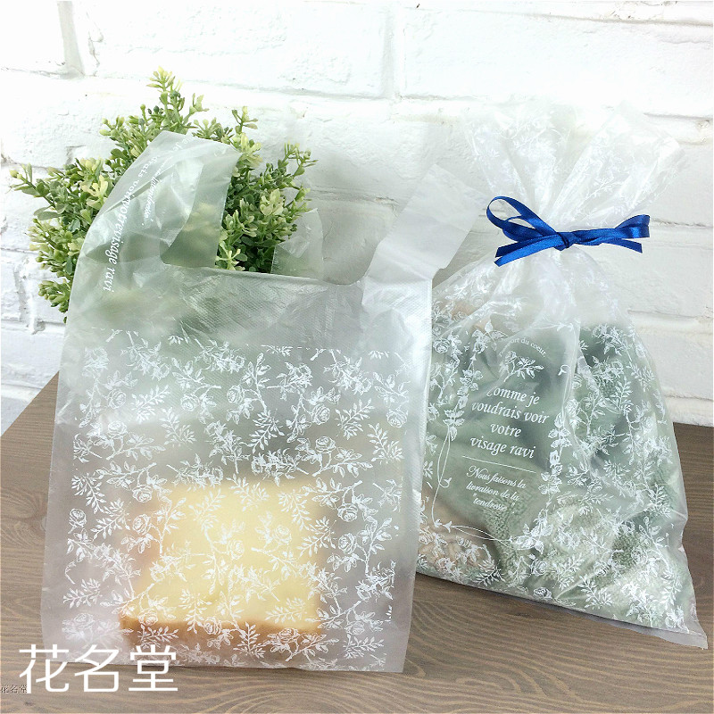 Day-style transparent small flower plastic bag hand shopping bag Horse clamping bag Food packaging bag wholesale 100 pieces of clothing