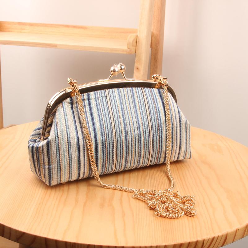 Patchwork handmade free cutting and ironing gold stripe stone pattern light gold smooth surface 22 curved mouth gold bag DIY material bag