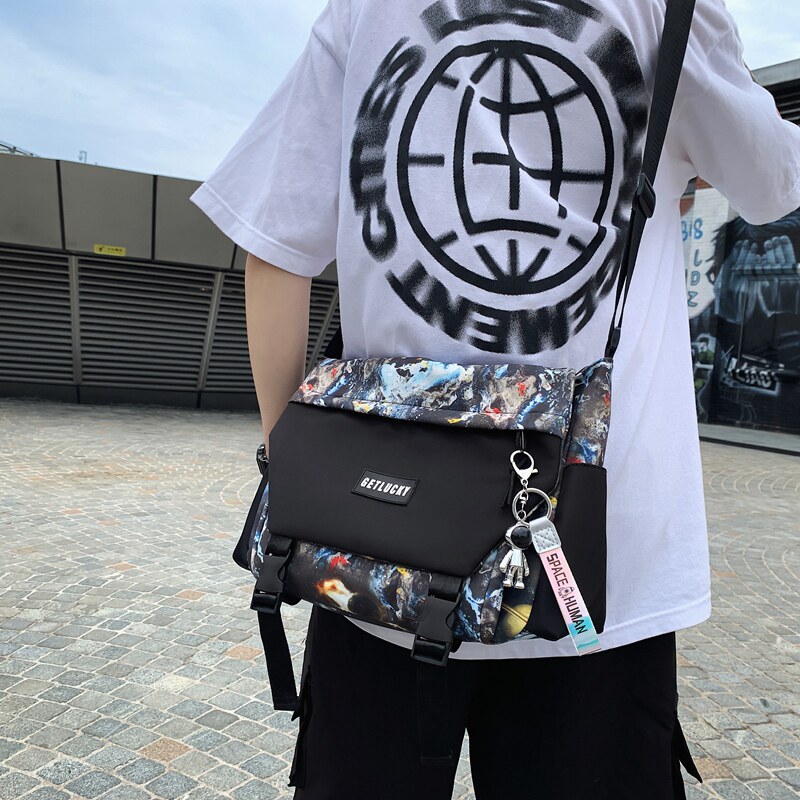 Camouflage graffiti fashion student class bag tutorial bag men's single shoulder bag spaceman flip messenger bag Messenger bag