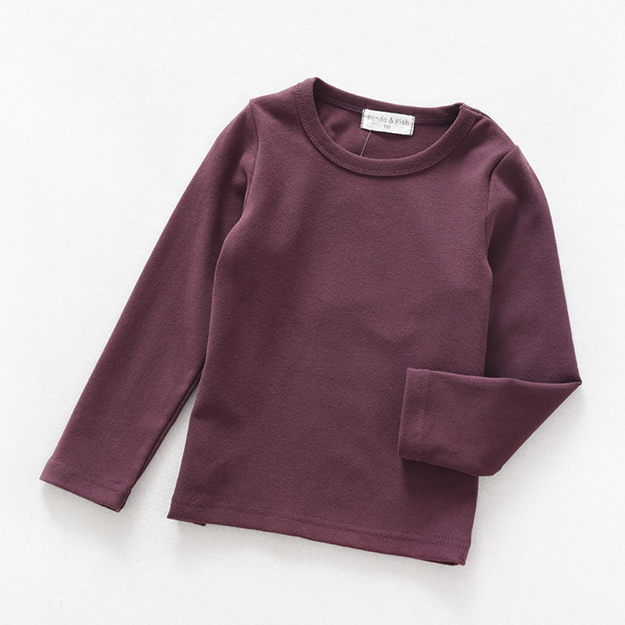 Sơn Đông cửa hàng quần áo trẻ em cửa hàng quần áo trẻ em cotton đáy quần áo trẻ em lớn tay áo thun dài tay màu kẹo áo thun bé trai