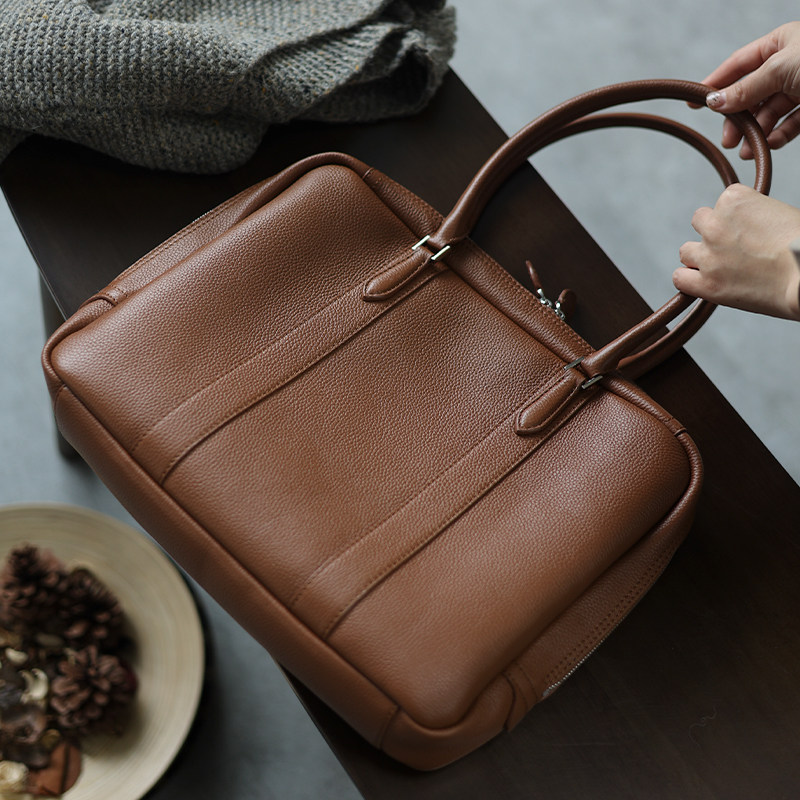 The Jazz is small and strong) The workplace can be just as easy as it can be) Genuine leather long handle briefcase briefcase 13 3 computer bag commuter bag