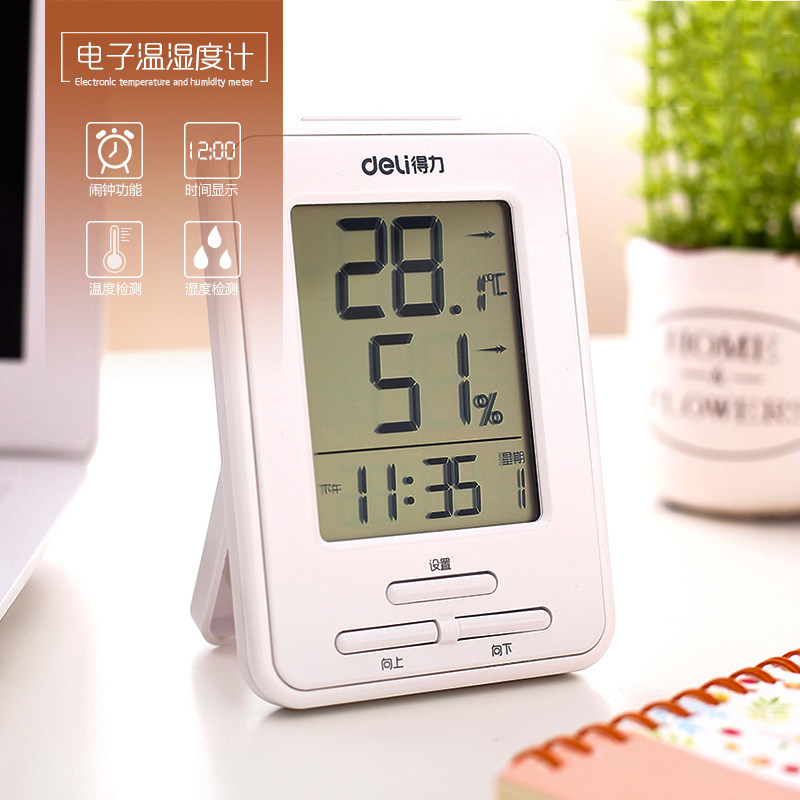 Electronic humitometer with alarm clock desktop thermometer in the home office of the right-hand electronic humitometer