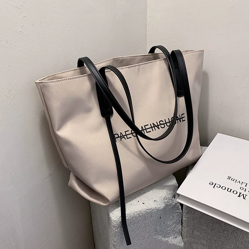 Demi-season capacious shoulder bag