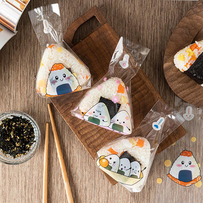 100 Japanese triangular rice ball packaging bags for food use, with stickers included, can be heated in a microwave oven