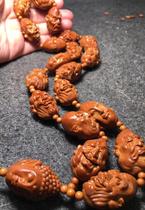 Nuclear carving fan famous Han Zhongjun single-sided eighteen arhans old oil nuclear red material realistic arhant pure hand carving