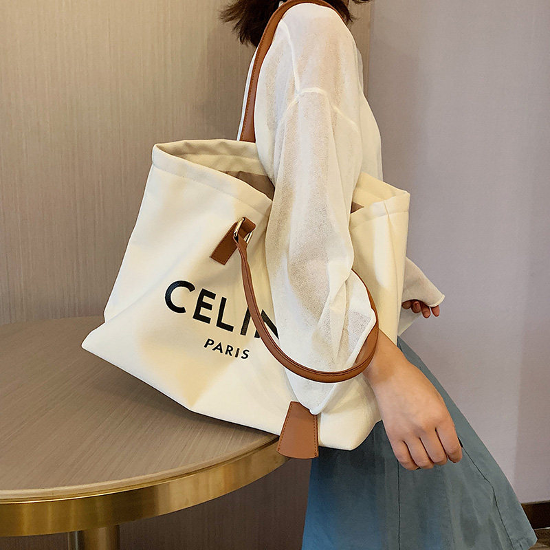 Canvas bag bag women's summer 2022 new trendy commuter niche tote cloth bag large-capacity all-match hand-carrying shoulder bag