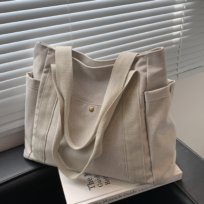 Hong Kong bag women's summer 2022 new high-end large-capacity canvas bag one-shoulder portable commuter tote bag
