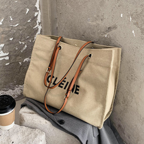 Canvas bag female 2022 new college student class commuter bag shoulder messenger tote bag large capacity all-match