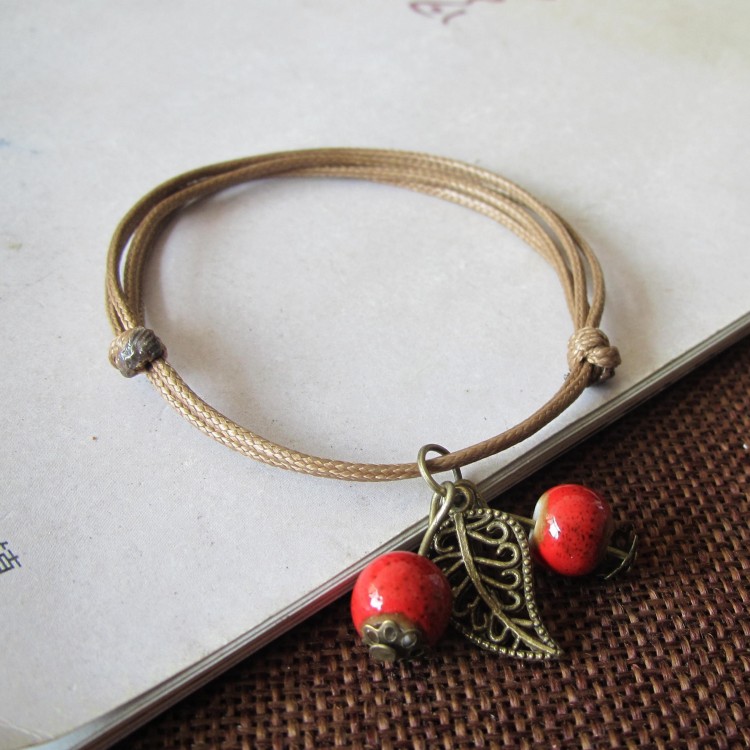 Phiên bản Hàn Quốc của thời trang vòng tay gốm cherry nữ quà tặng sinh viên ngọt ngào Jingdezhen trang sức gốm một nhân dân tệ vòng tay cao su