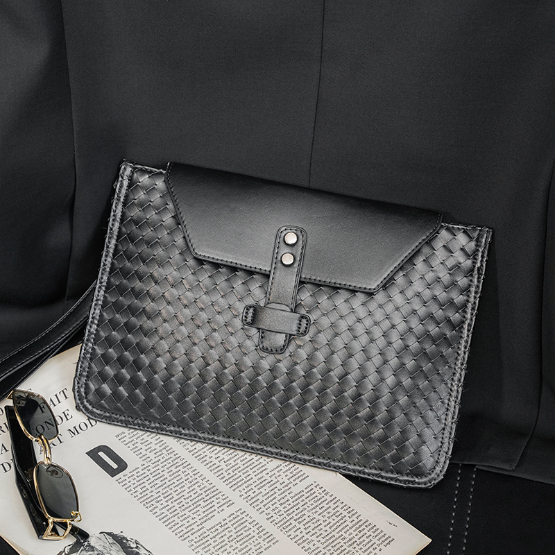 2022 new Korean version hand grip bag personality flip woven cortical hand grab bag casual light business ipad bag