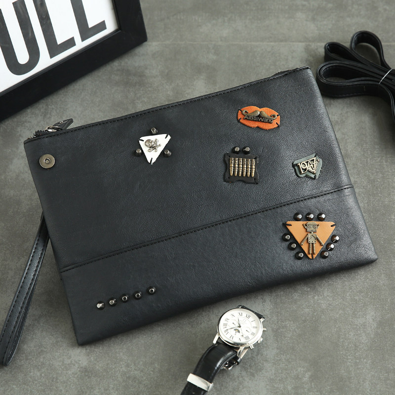 Korean version of the new men's hand grip Fashion Leather rivets Cortex Hands bag Leisure Street ipad File Package