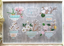 Italian designer with DMC cross stitch Winter Cup flower