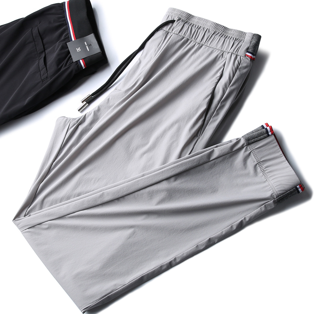 Summer new breathable silk sliding four-side slingshot color waist men's fashion body tightness waist and small foot casual pants