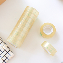 Student with small roll of transparent adhesive tape 30 m Small number of office stationery 1 2cm narrow rubberized adhesive tape correction with sticky note