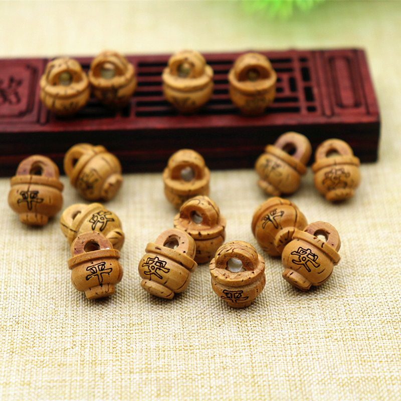 Handmade wild dragon pattern peach core carving student baby children's hand and foot chain pendant diy red rope ornament baby safety basket