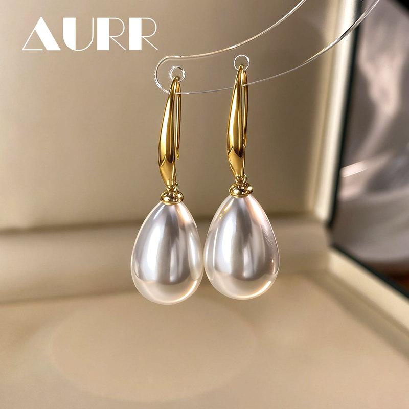 Three-Sided Original Design of a Girl Wearing Pearl Earrings, Large Water Drop Artificial Australian White Earrings, Ear Hooks, Titanium Alloy