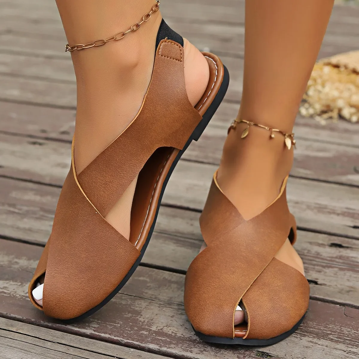 2025 New Foreign Trade Roman Sandals Women's Baotou Side Hollow Flat Bottom Cross Soft Leather Elastic Band European and American Large Size Sandals