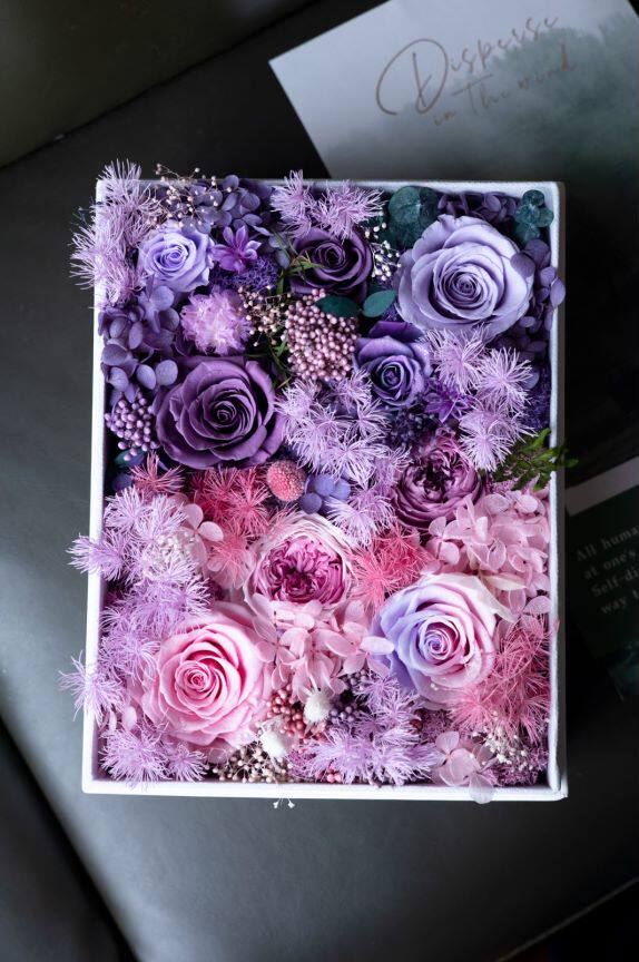 Preserved roses in a purple-pink gift box arrangement