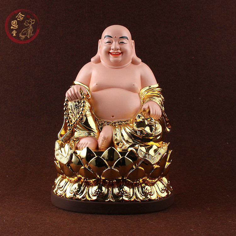 Resin sitting like the gilded Millerson Bodhisattva Millver seated with a smile over the Buddha's future Buddha's knots.