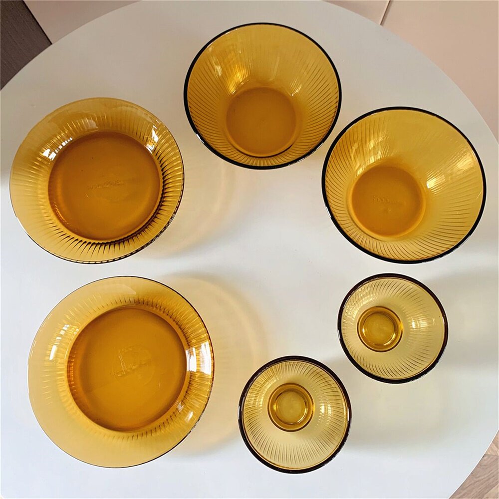 Six sets of heat resistant glass cutlery dishes on the side