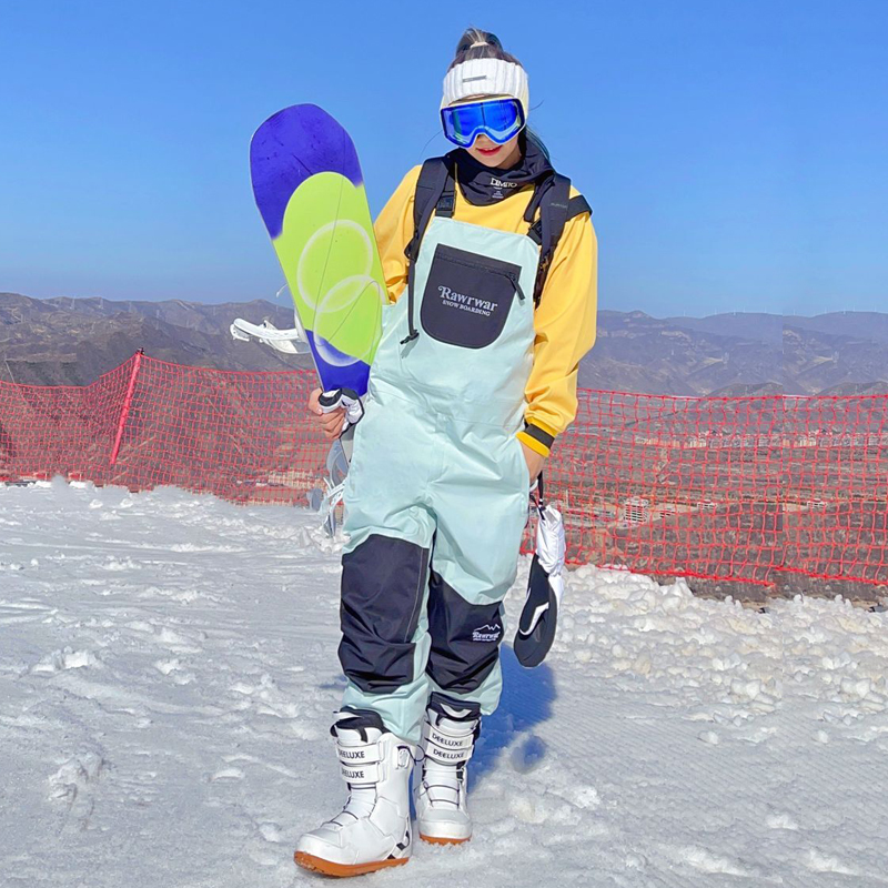 Winter new Korean version of ski overalls waterproof splicing contrast color veneer double board self-cultivation men's and women's warm snow pants