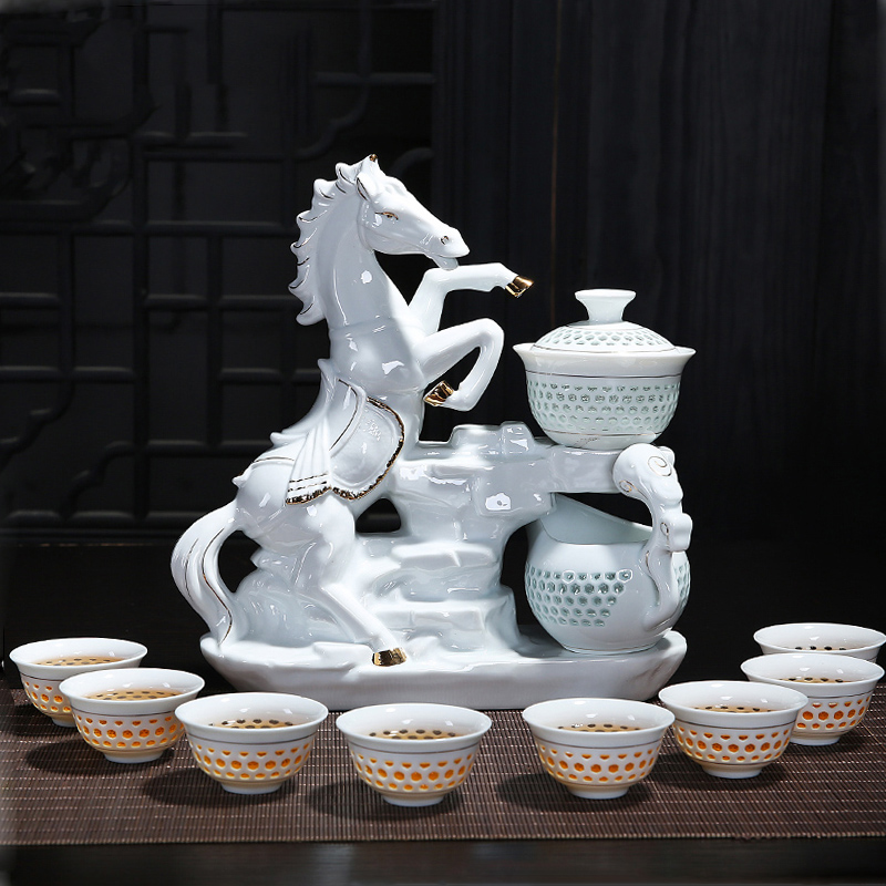 Creative blue and white porcelain ceramic kung fu tea sets with ceramic and exquisite hollow out of a complete set of automatic tea set