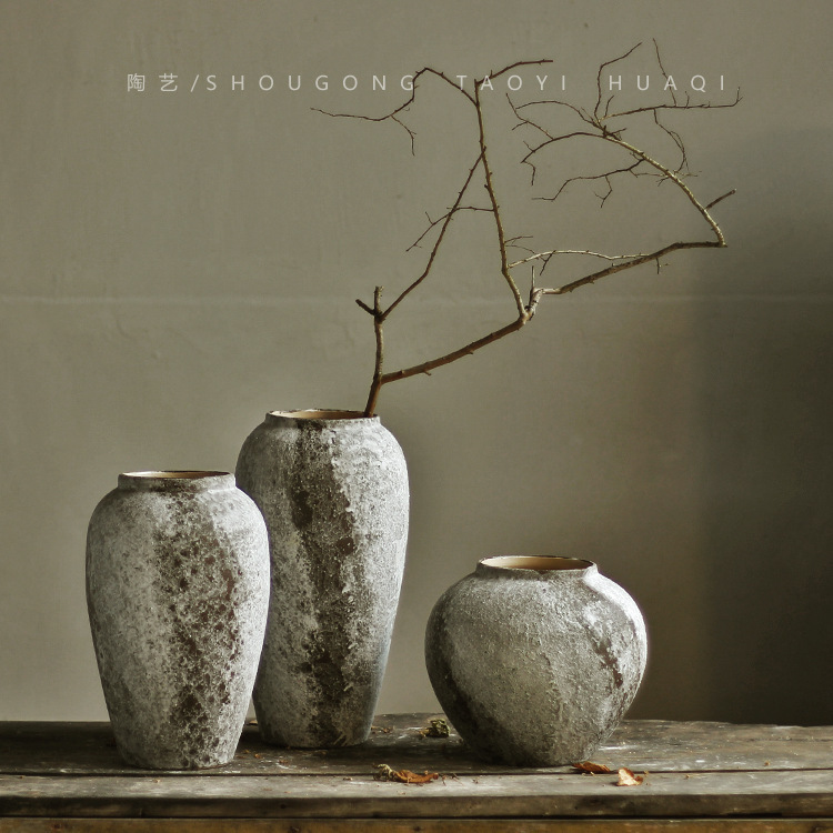 Designers Carefully Selected a Distressed Ceramic Vase in a Wabi-Sabi Style for the Model Room, a Vintage Rustic Pottery Vessel for the Living Room