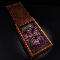 A set of three-color jade bracelets for the Qing court a pair of antique jade bracelets and a lacquerware box made in the Qianlong period of the Qing Dynasty.