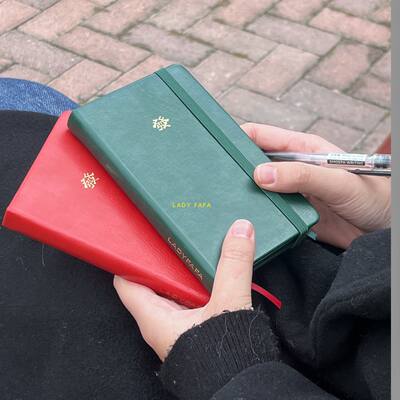 ladyfafa carries a mini pu leather notebook for good luck and prosperity with blank pages