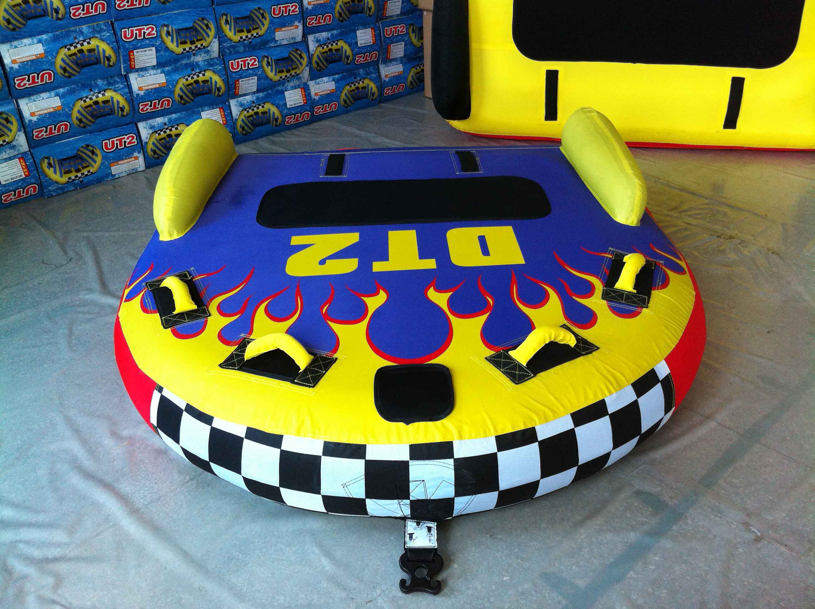 2 people on water Mormon boat drag surf inflatable drag laps water sofas fly fish banana boat