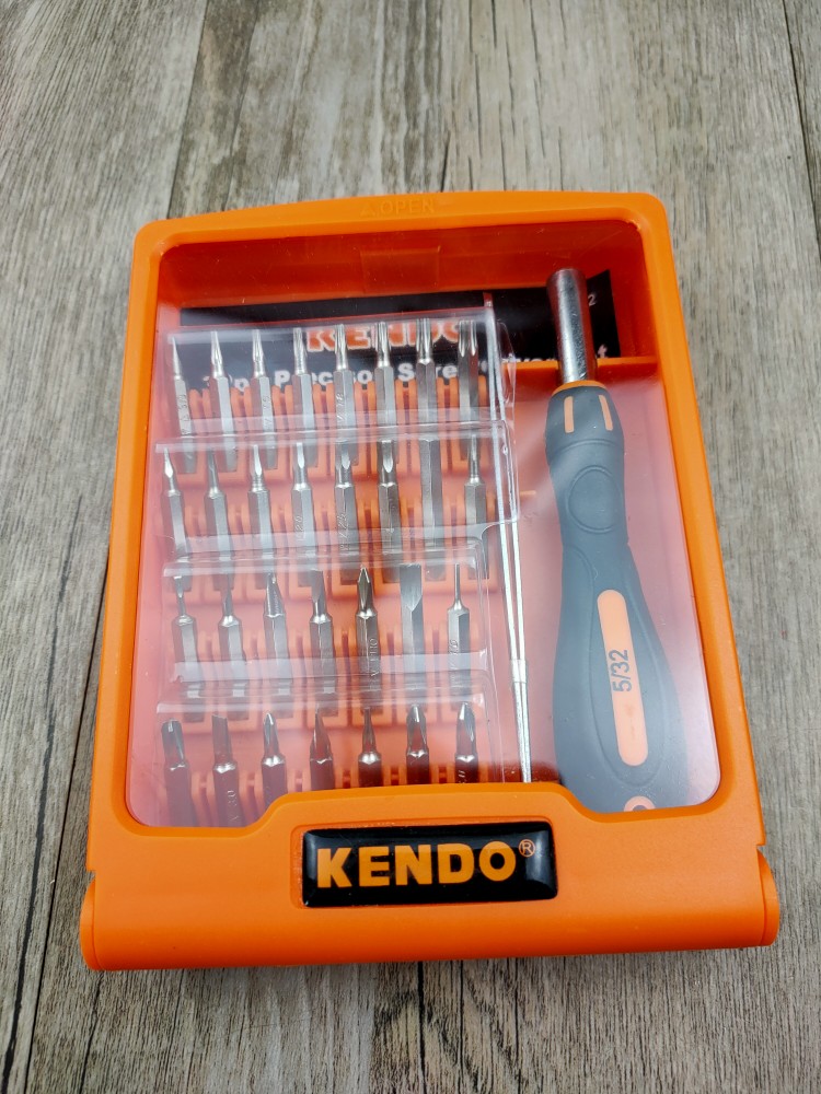A combination of a replaceable head screwdriver