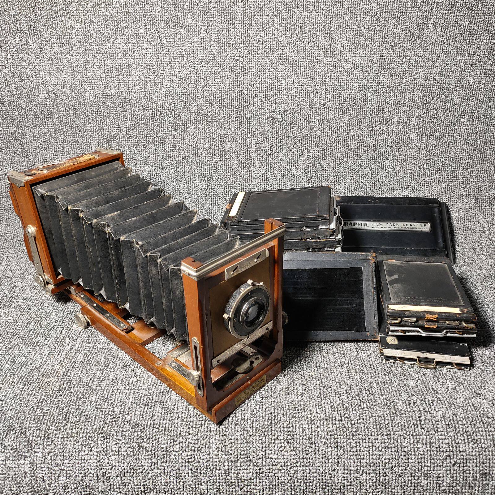 Wooden leather cavity old camera with wooden tripod Griffith clip Literary retro ornaments collection of old objects