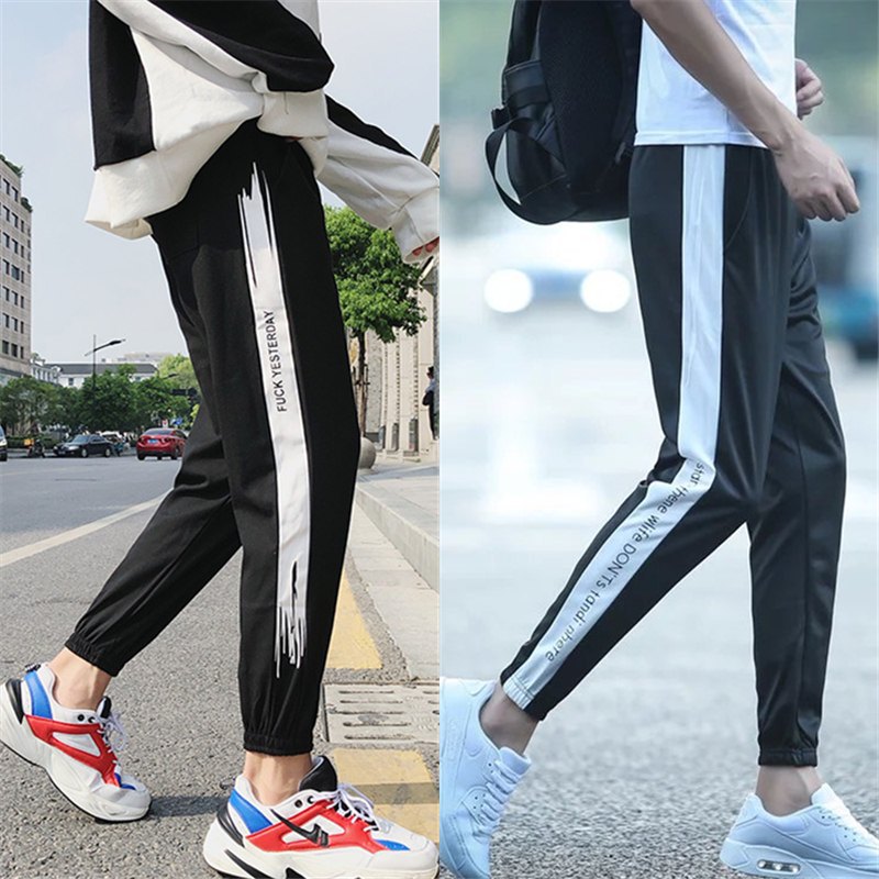 Quần thể thao nam Phiên bản Hàn Quốc của quần xu hướng chân váy rộng học sinh thường xuyên quần chín điểm quần quần harem quần jogger nam
